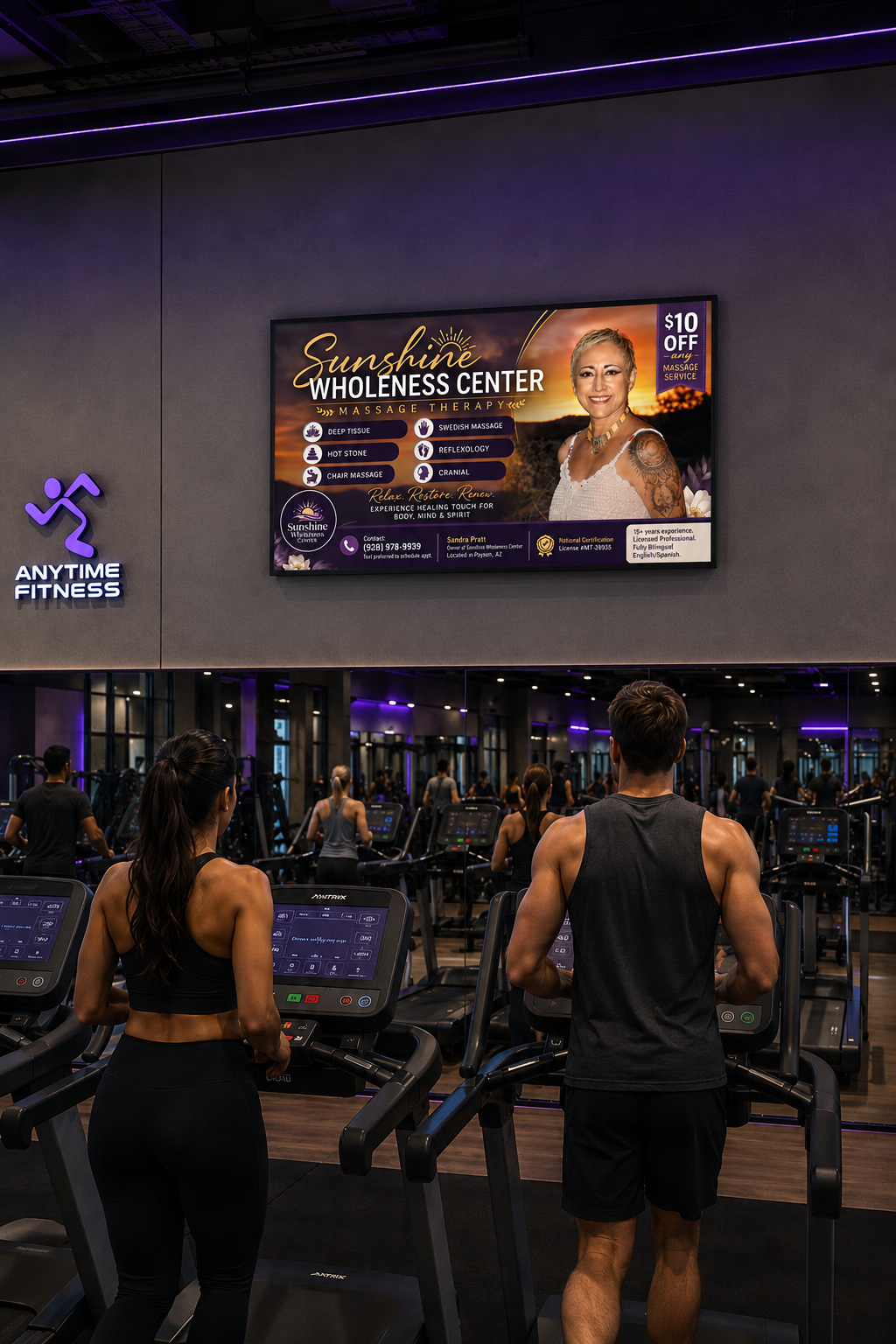 Full-screen AdSync TV ad inside Anytime Fitness gym showing local business advertisement on 55 inch TV