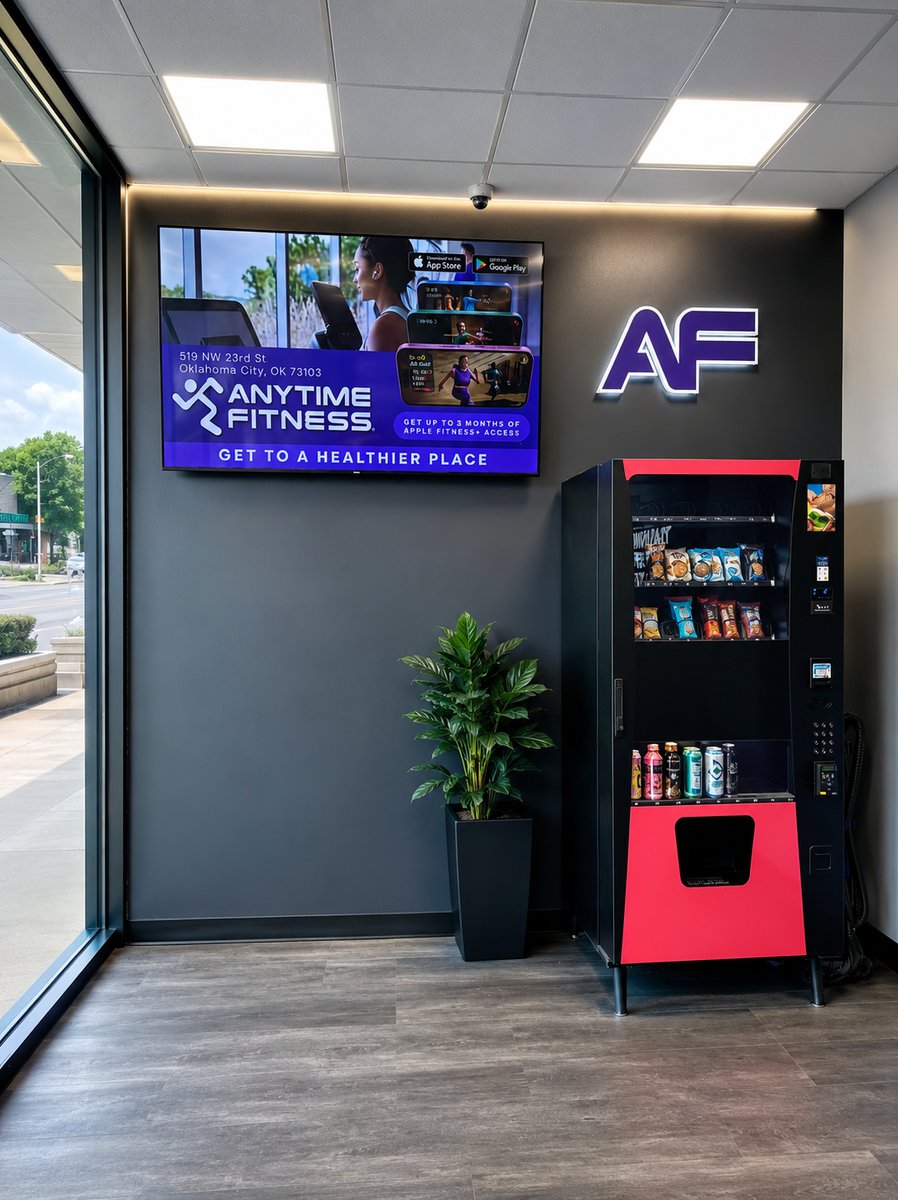 AdSync digital screen installed at Anytime Fitness Oklahoma City displaying a full-screen advertisement
